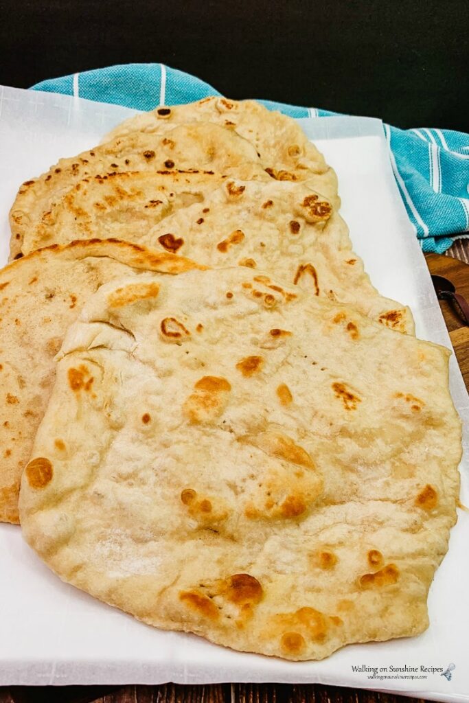 Flatbread on white platter.