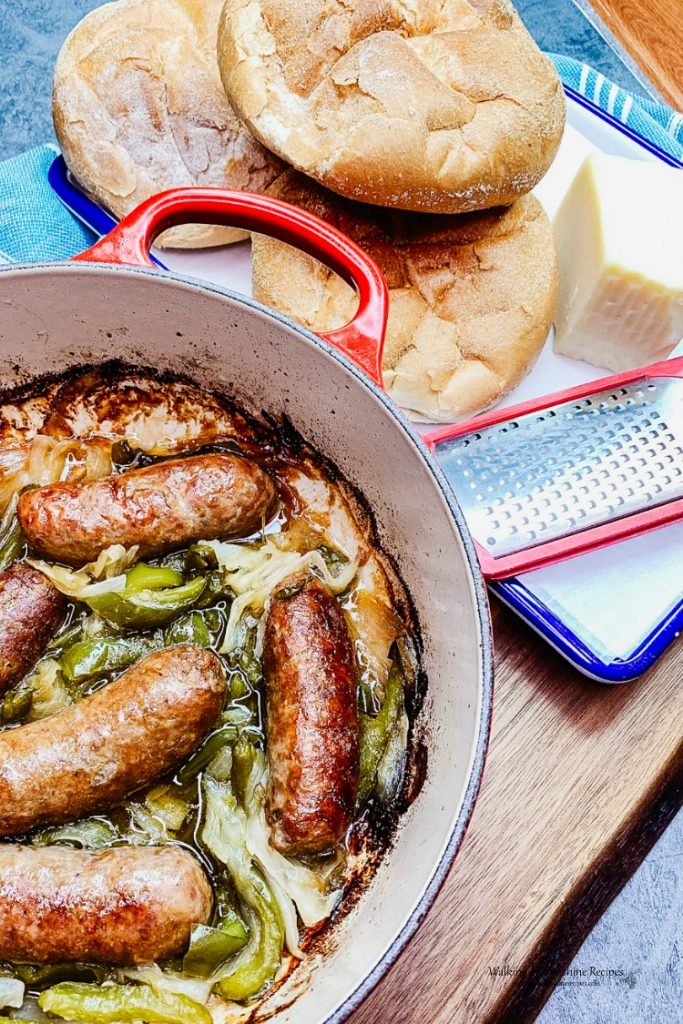 How to Serve Sausage and Peppers with Crusty Kaiser Rolls and Grated Parmesan Cheese
