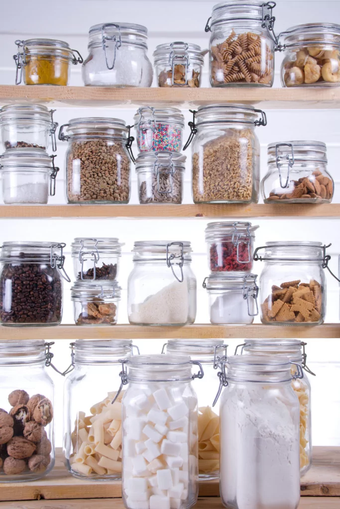 Mason jars filled with pantry essentials for a well-stocked kitchen. 
