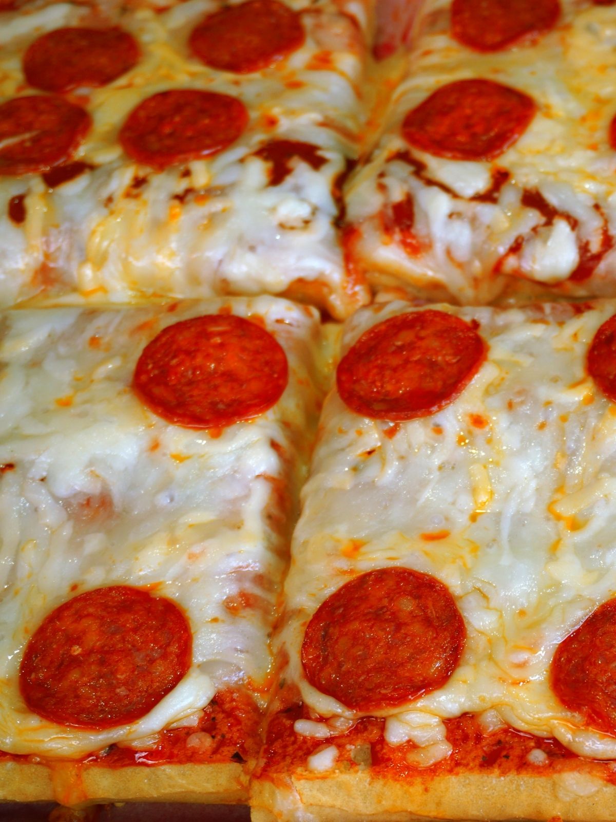 pizza with cheese and sliced pepperoni.