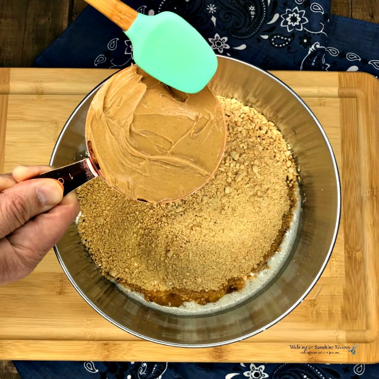 Peanut butter in measuring cup added to Graham Cracker Crumbs