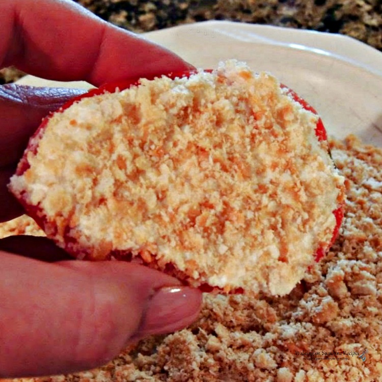 Tomato stuffed with ricotta cheese and topped with crushed Ritz crackers