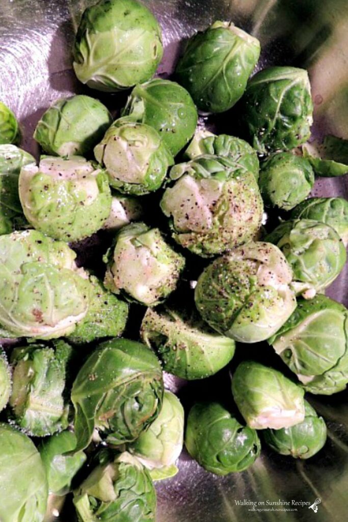 Toss Brussels Sprouts with salt, pepper and oil before roasting
