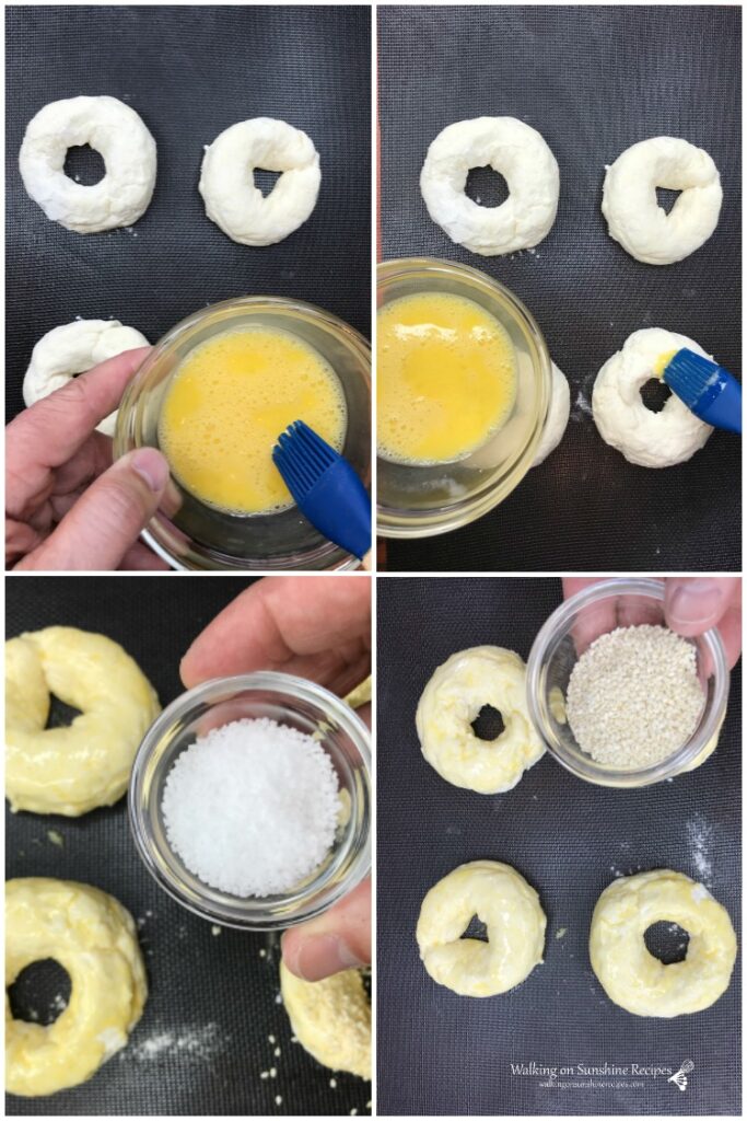 Brushing egg was on top of bagels and sprinkling salt and sesame seeds on top.