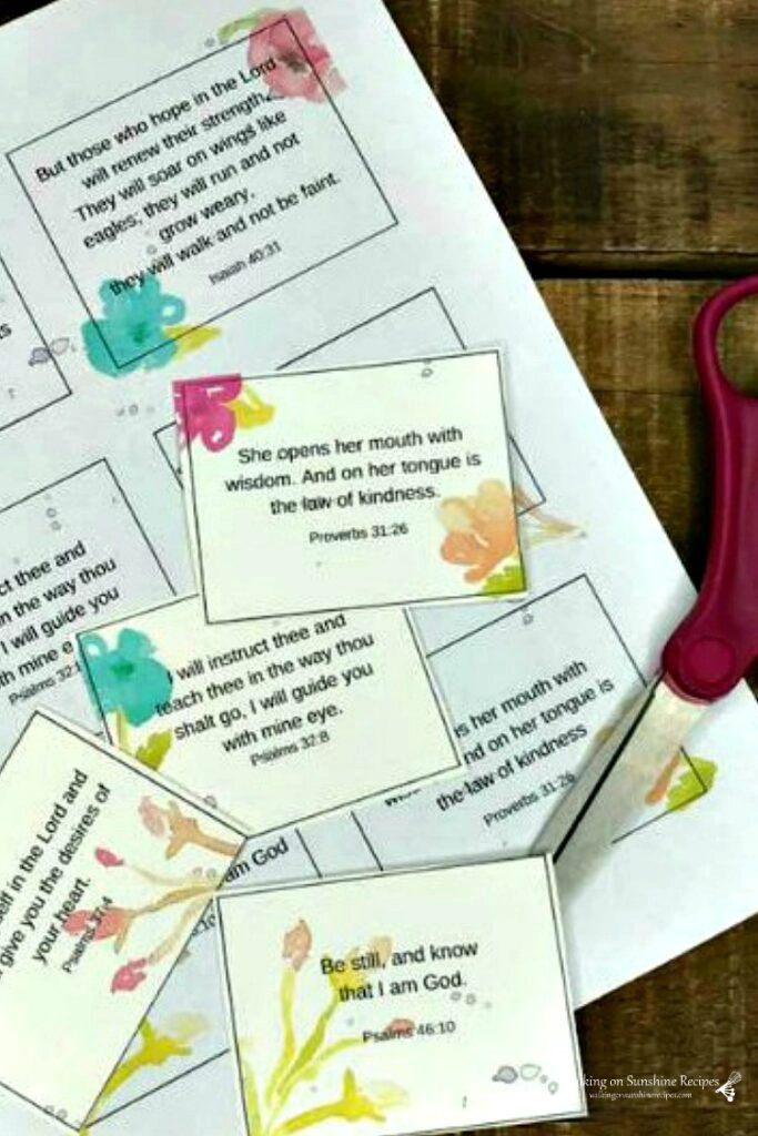 Printable Scripture cards on board with scissors.