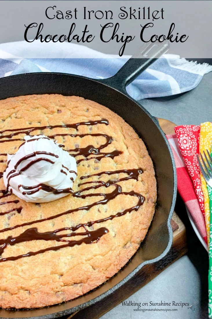 Large chocolate chip cookie made in a cast iron skillet pan. 