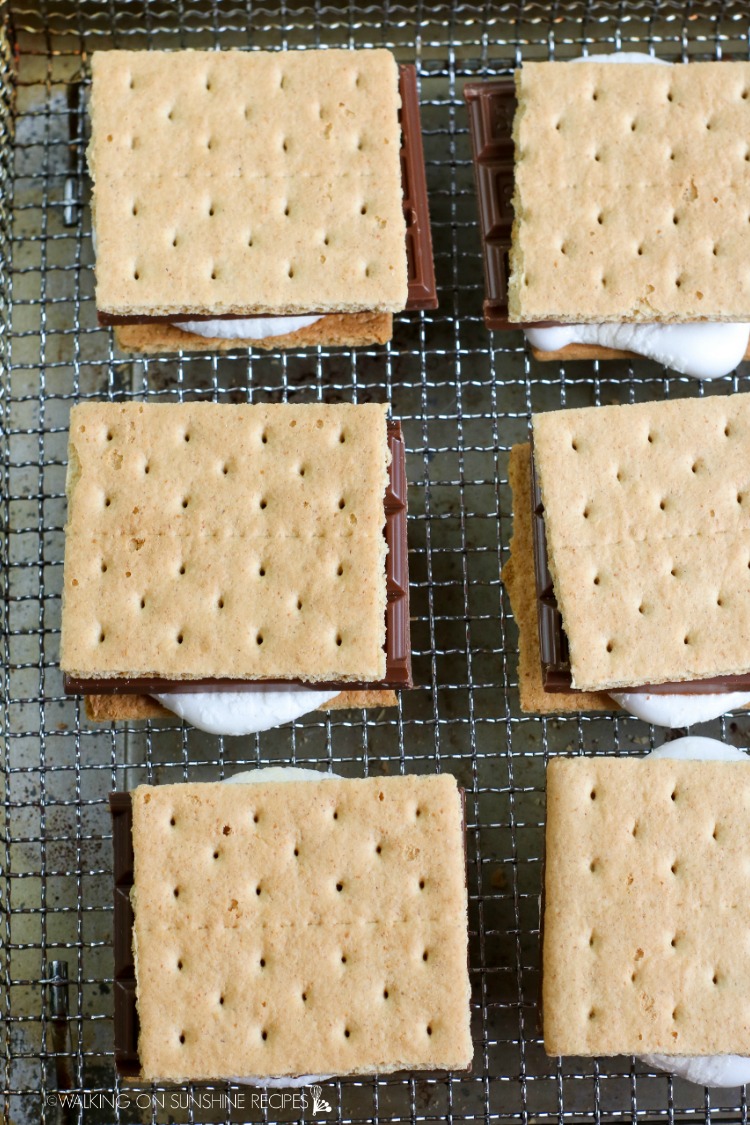 Add the second layer of graham crackers on top of the chocolate and marshmallow