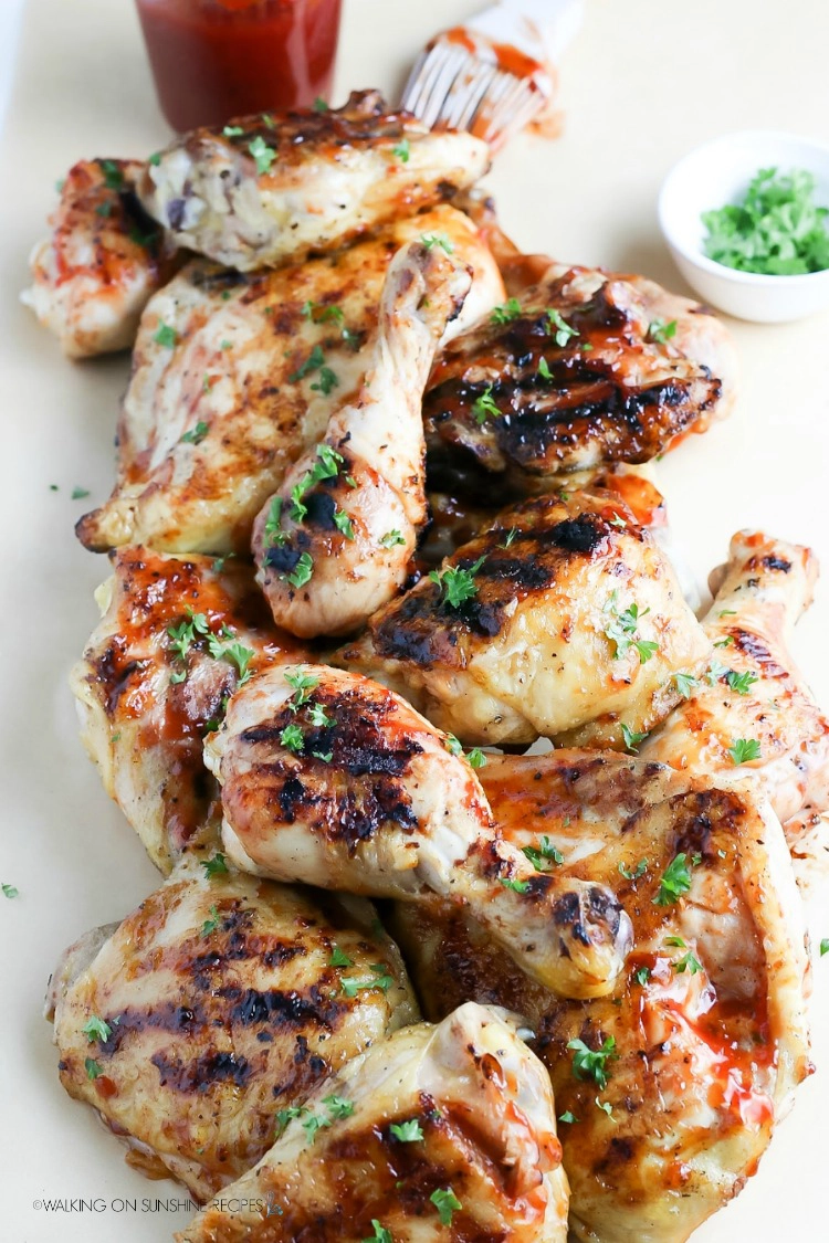 Barbecue Grilled Chicken Thighs and Legs on white platter