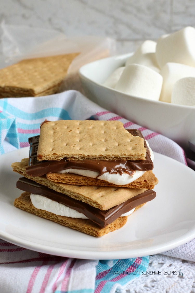 Air Fryer Smores on plate cooked with melted chocolate and marshmallows.