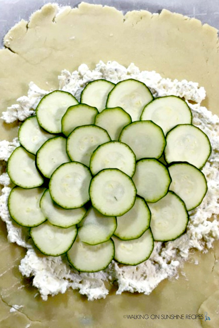 Add the zucchini rounds on top of the ricotta cheese mixture. 