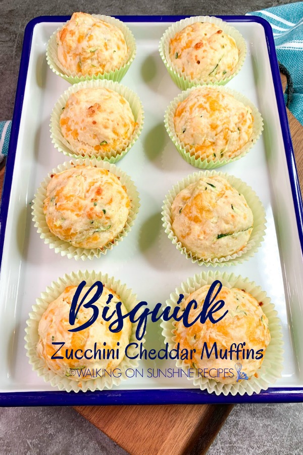 Zucchini Cheddar Muffins on white serving platter.