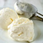 scoops of vanilla ice cream on a plate