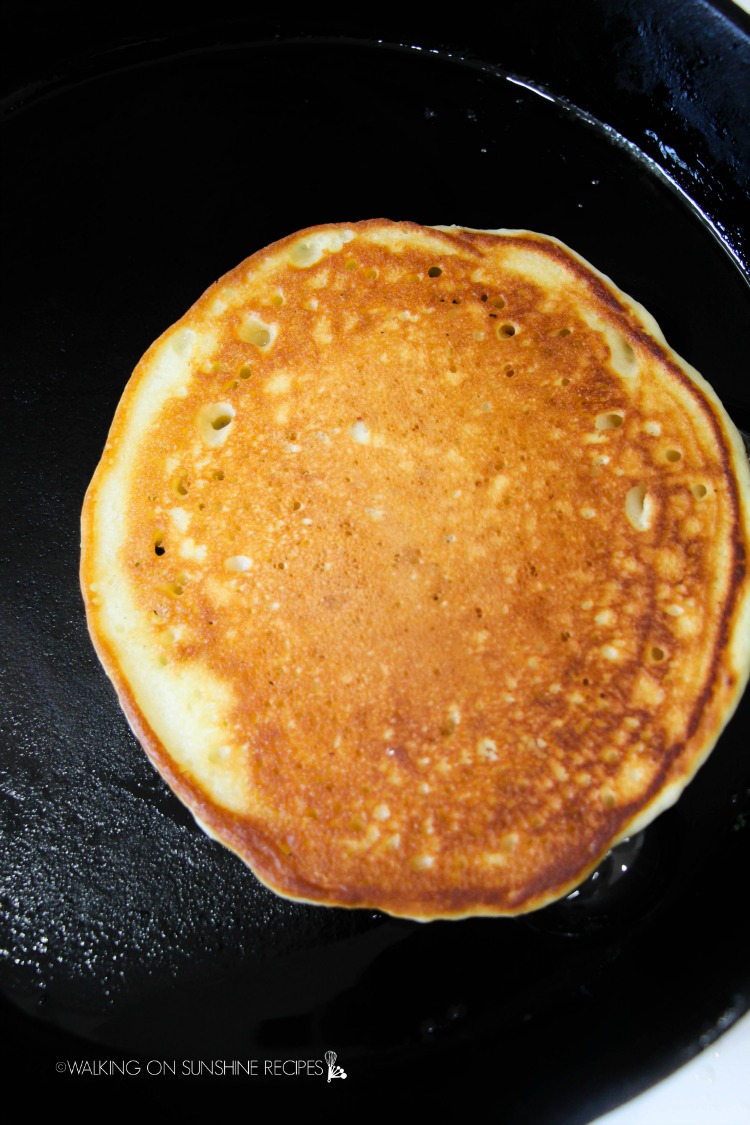 Cooked pancake in cast iron pan. 