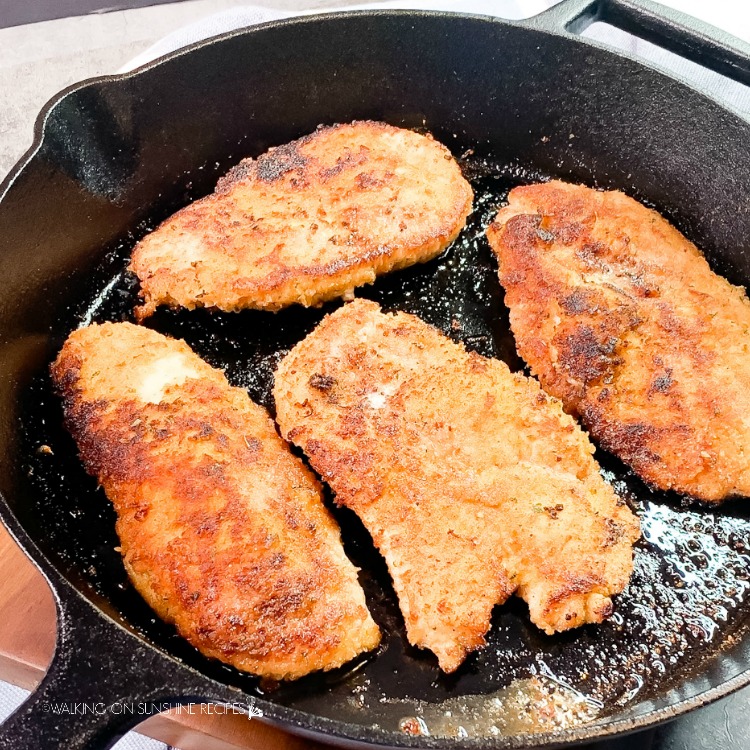 Chicken breasts cooked in cast iron skillet pan.