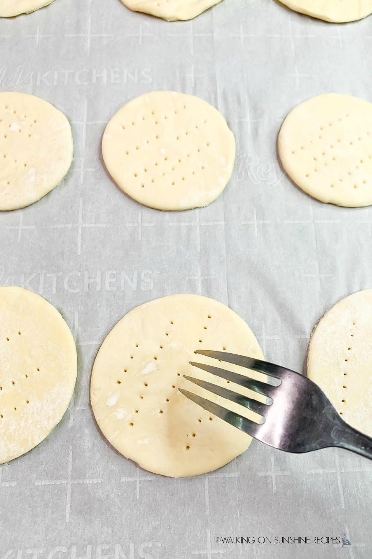 Prick the puff pastry circles with a fork