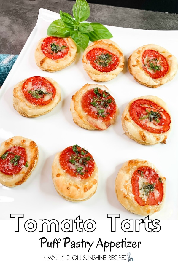 Tomato Tarts Puff Pastry Appetizer on White Tray with Basil Leaves
