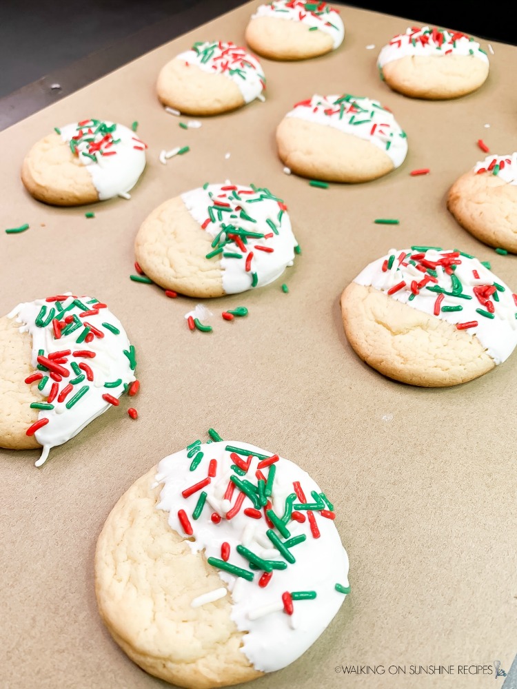 Decorated White Cake Mix Christmas Cookies on tray with parchment paper