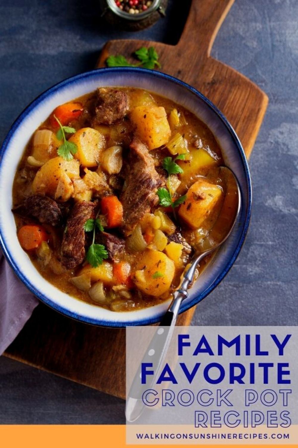 Family Favorite Crock Pot stew in bowl on cutting board.