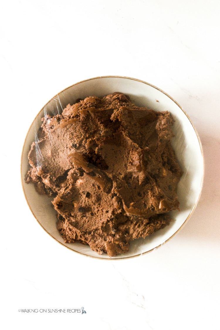 Chocolate Marshmallow Cookie Dough in bowl with plastic wrap on top