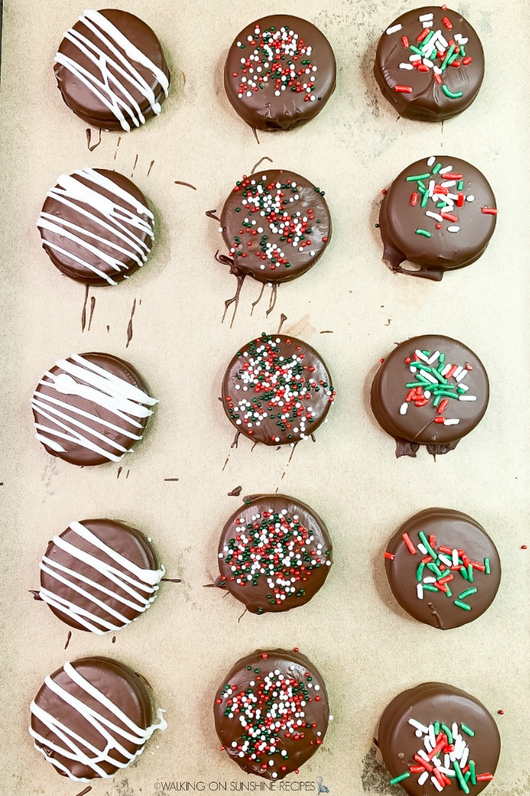 Chocolate Covered Oreos on baking tray layered with parchment paper