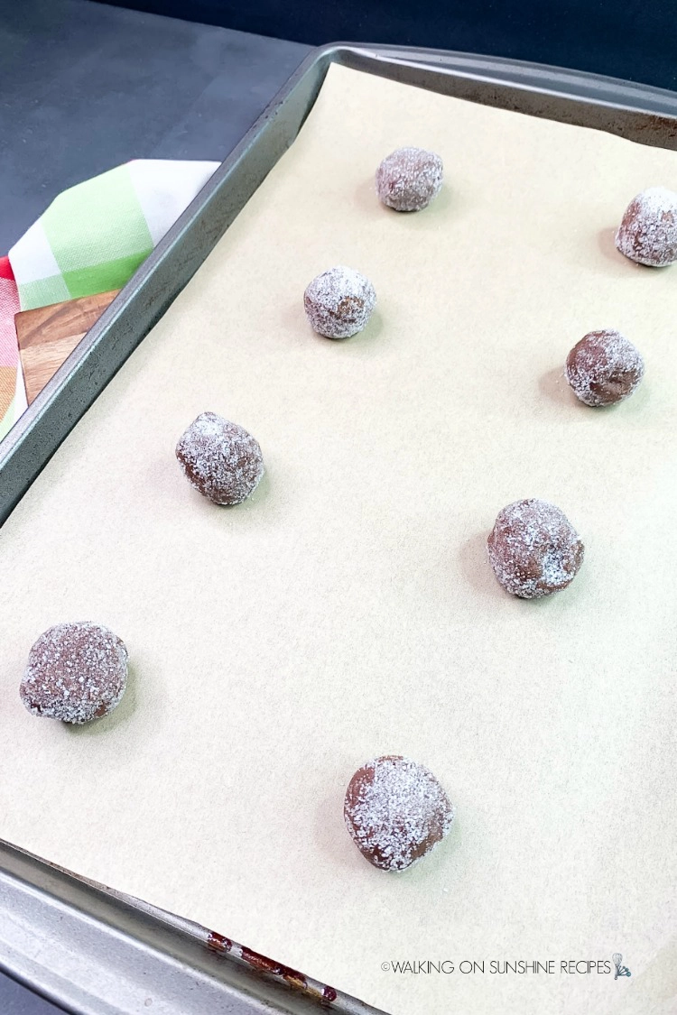 Place cookie balls rolled in sugar on baking tray