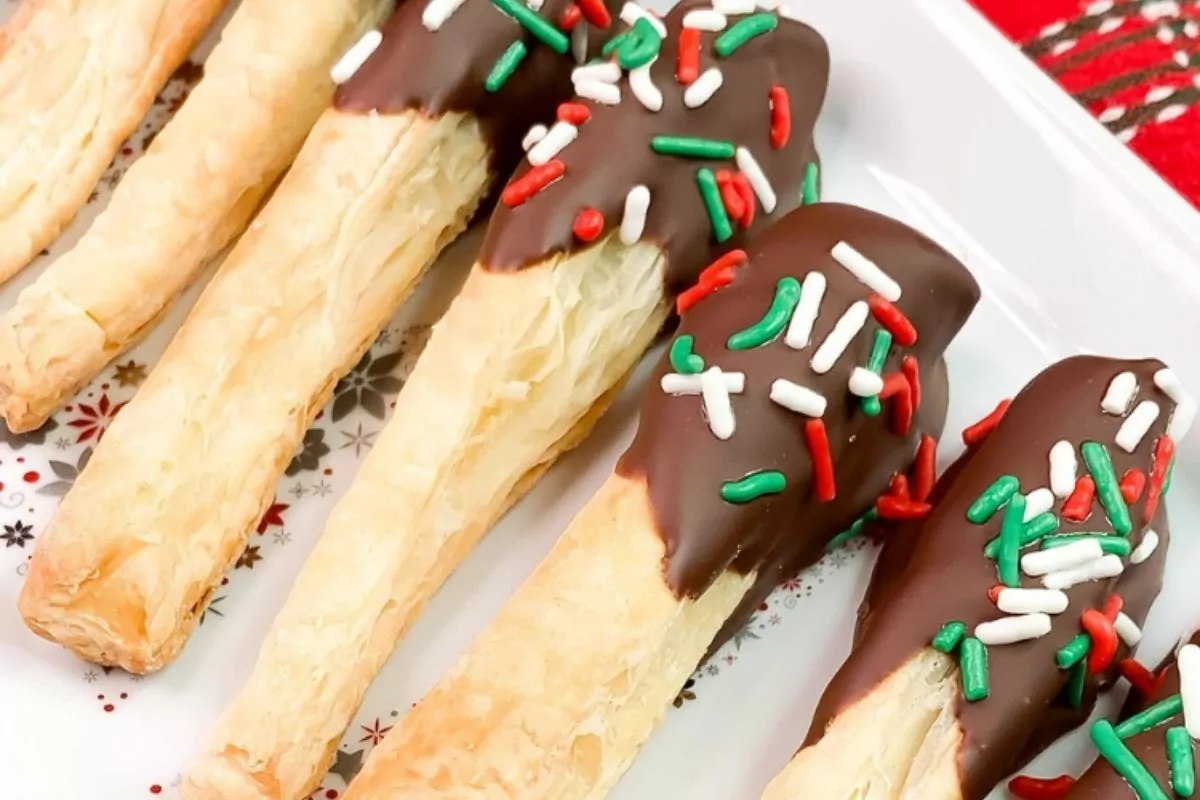 Puff Pastry sticks dipped in chocolate and christmas sprinkles