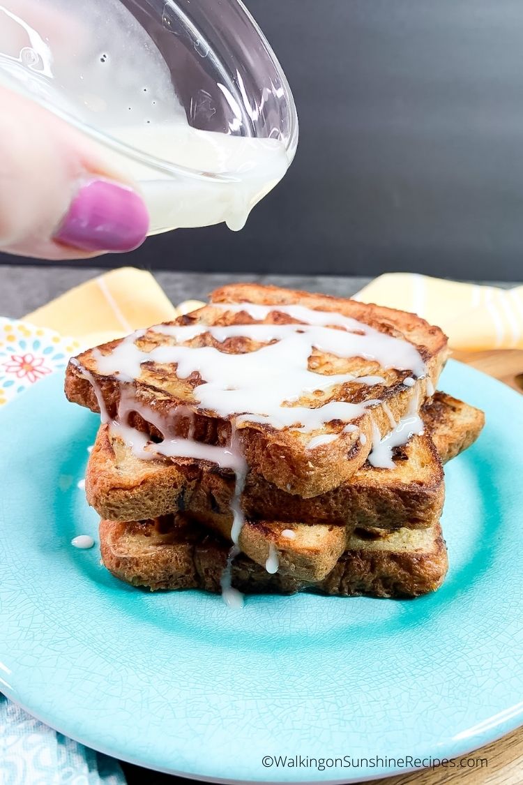 Pour sweetened glaze on top of French toast slices.