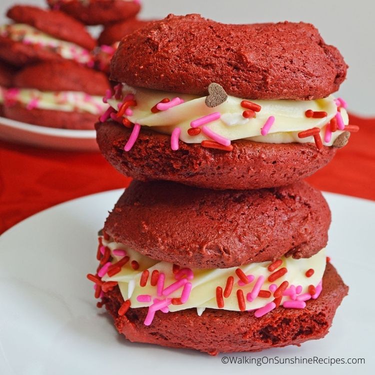 red velvet cookies with cream cheese frosting and sprinkles. 
