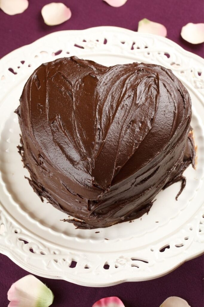 heart cake shape with chocolate frosting.