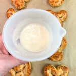 Add frosting to the top of the cinnamon roll bunnies