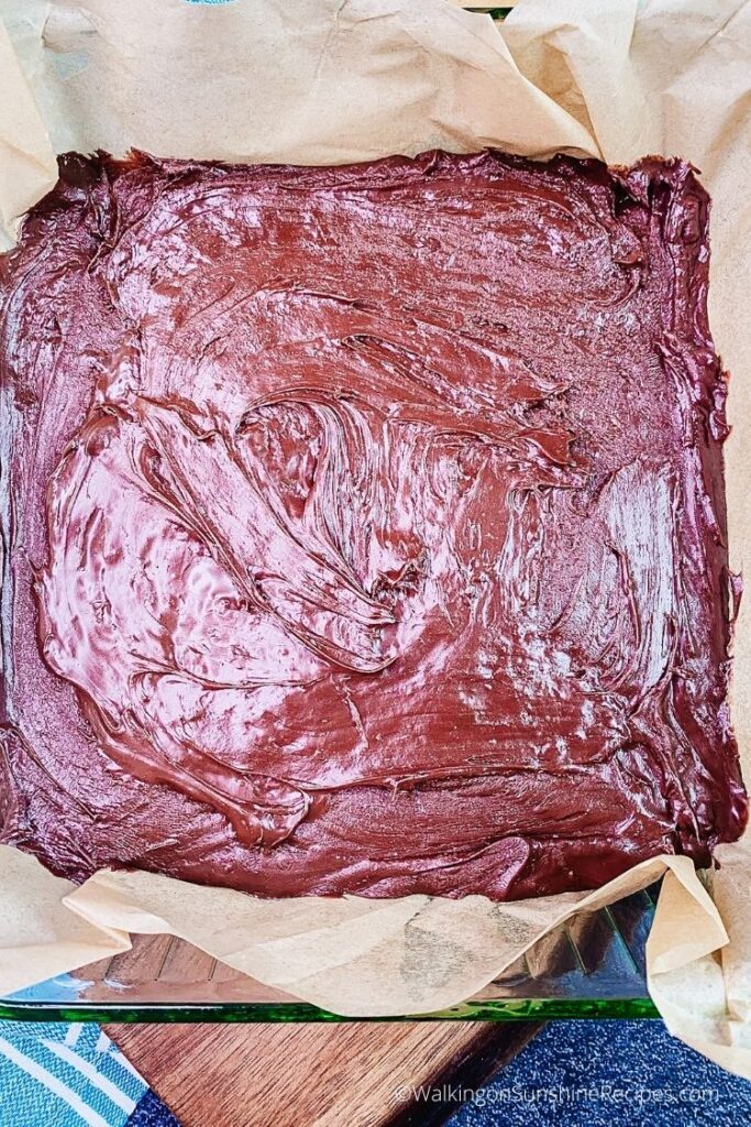 chocolate fudge in parchment lined baking dish.