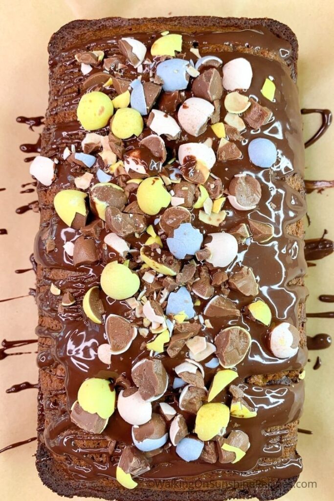 Banana bread with melted chocolate and crushed candy pieces.