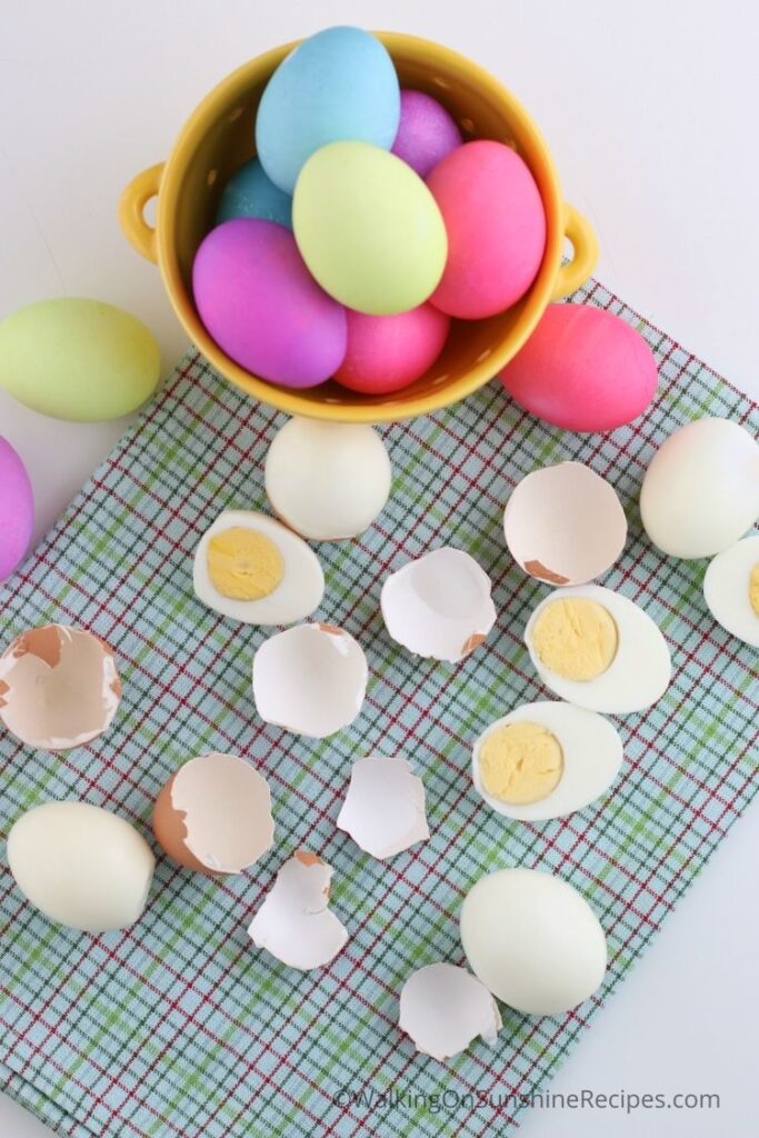 colored Easter eggs and cracked peeled eggs. 
