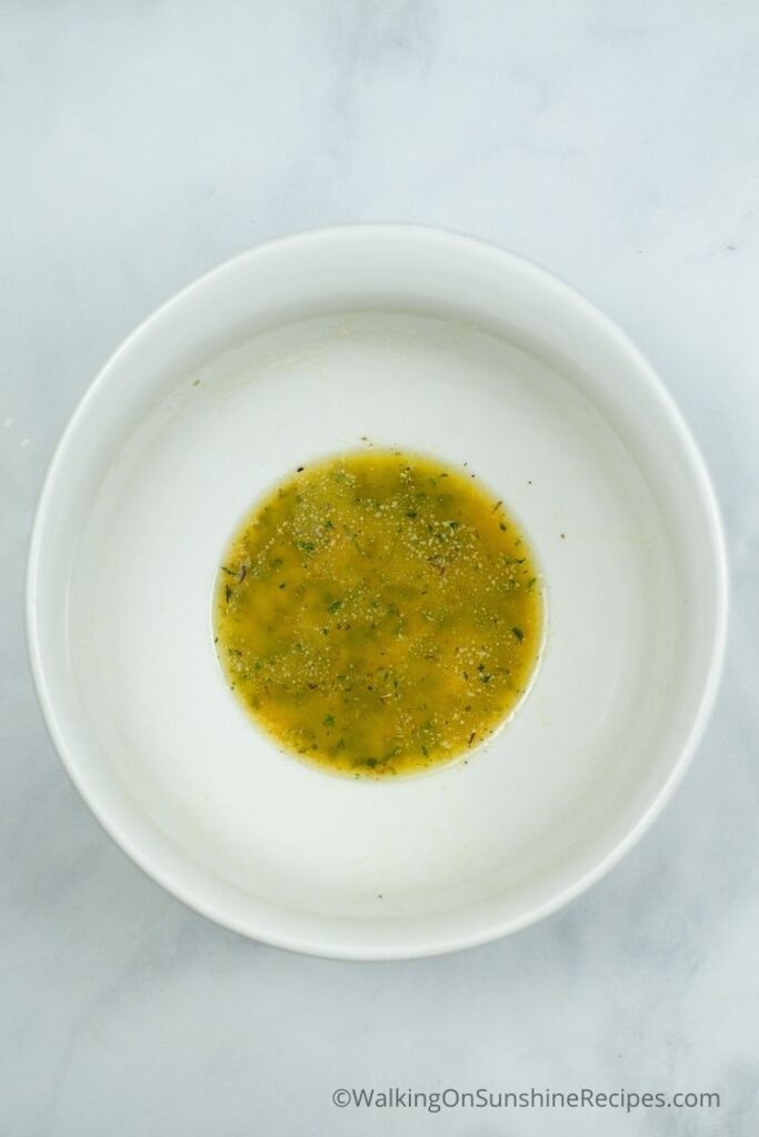 melted garlic butter in white bowl. 