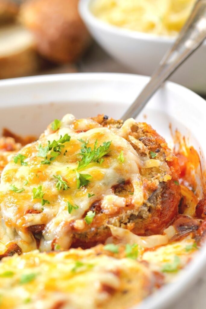 Eggplant Parmesan in white plate.