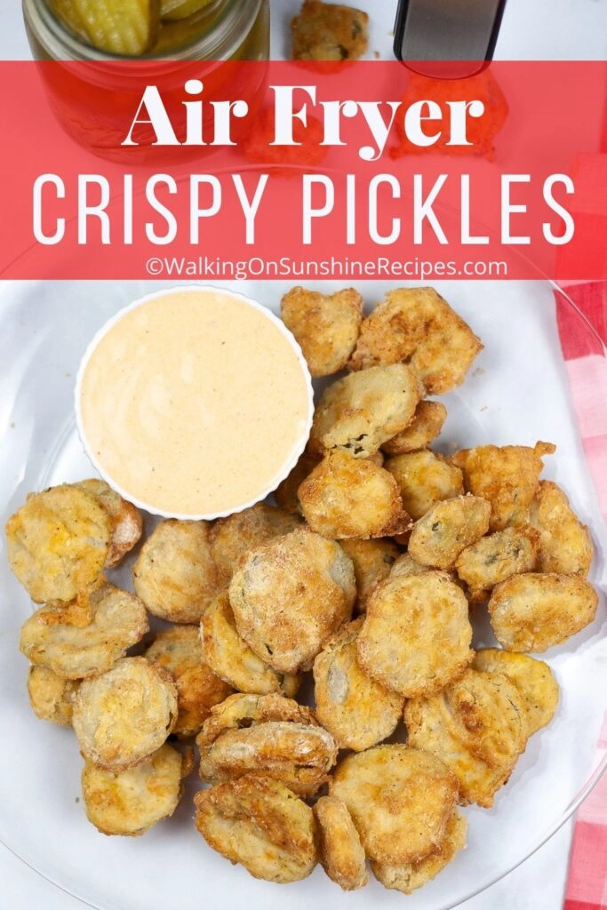 crispy pickles made in the air fryer on a plate with dipping sauce. 