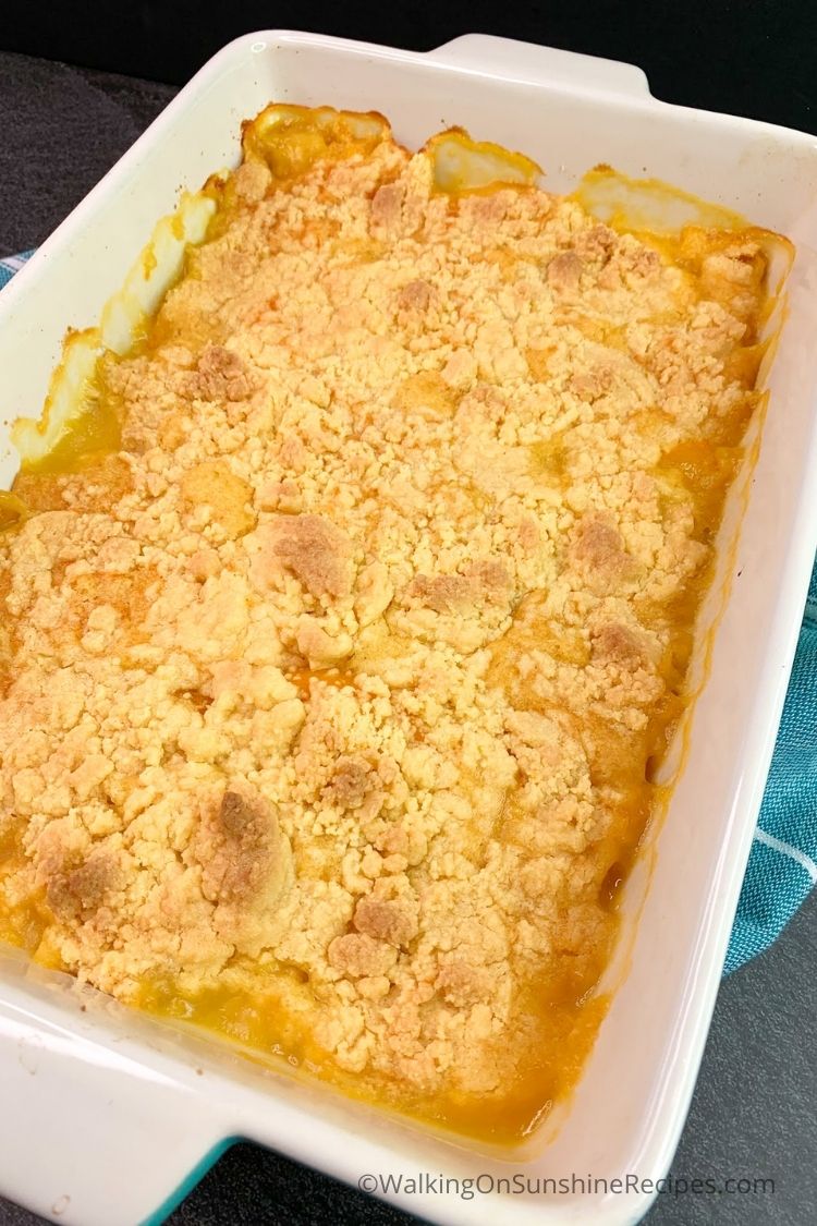 Baked peach cobbler with cake mix topping. 