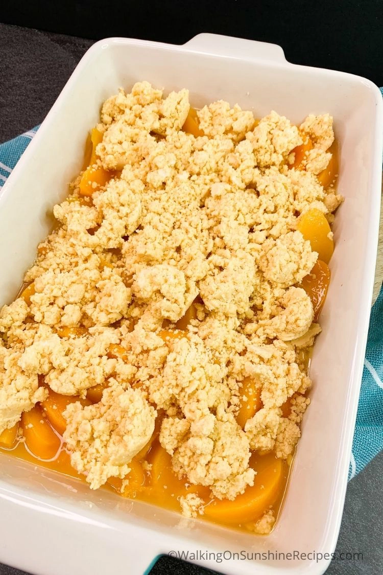 Canned peaches with peach crumb topping made from a cake mix. 