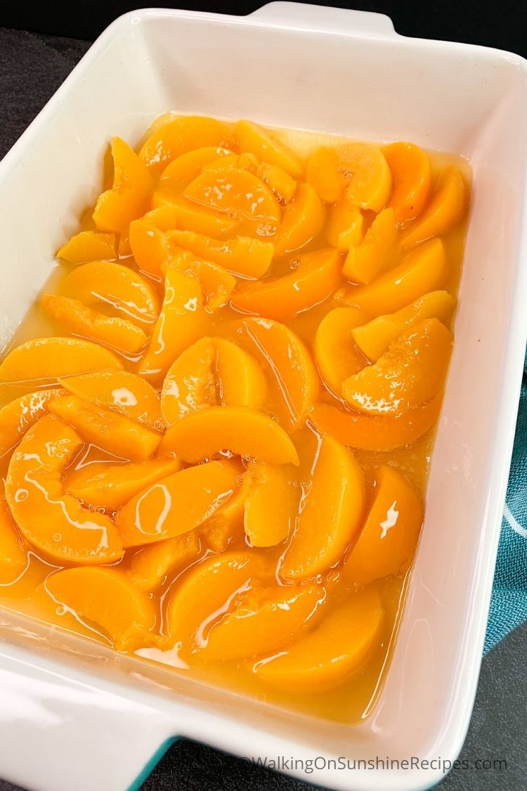 canned peaches in baking dish. 