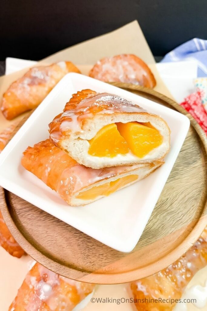 Cut open fried hand pie with canned peaches. 