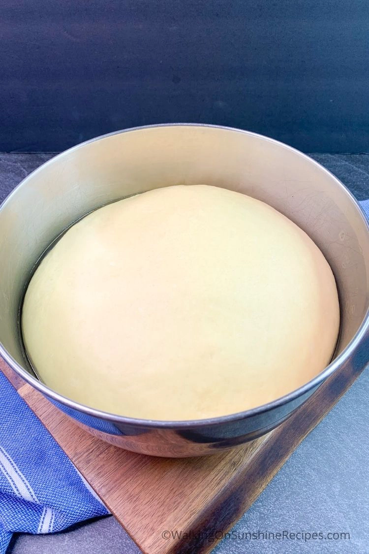 bread dough risen in bowl. 