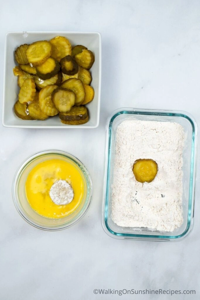 Dip pickles in egg and flour. 