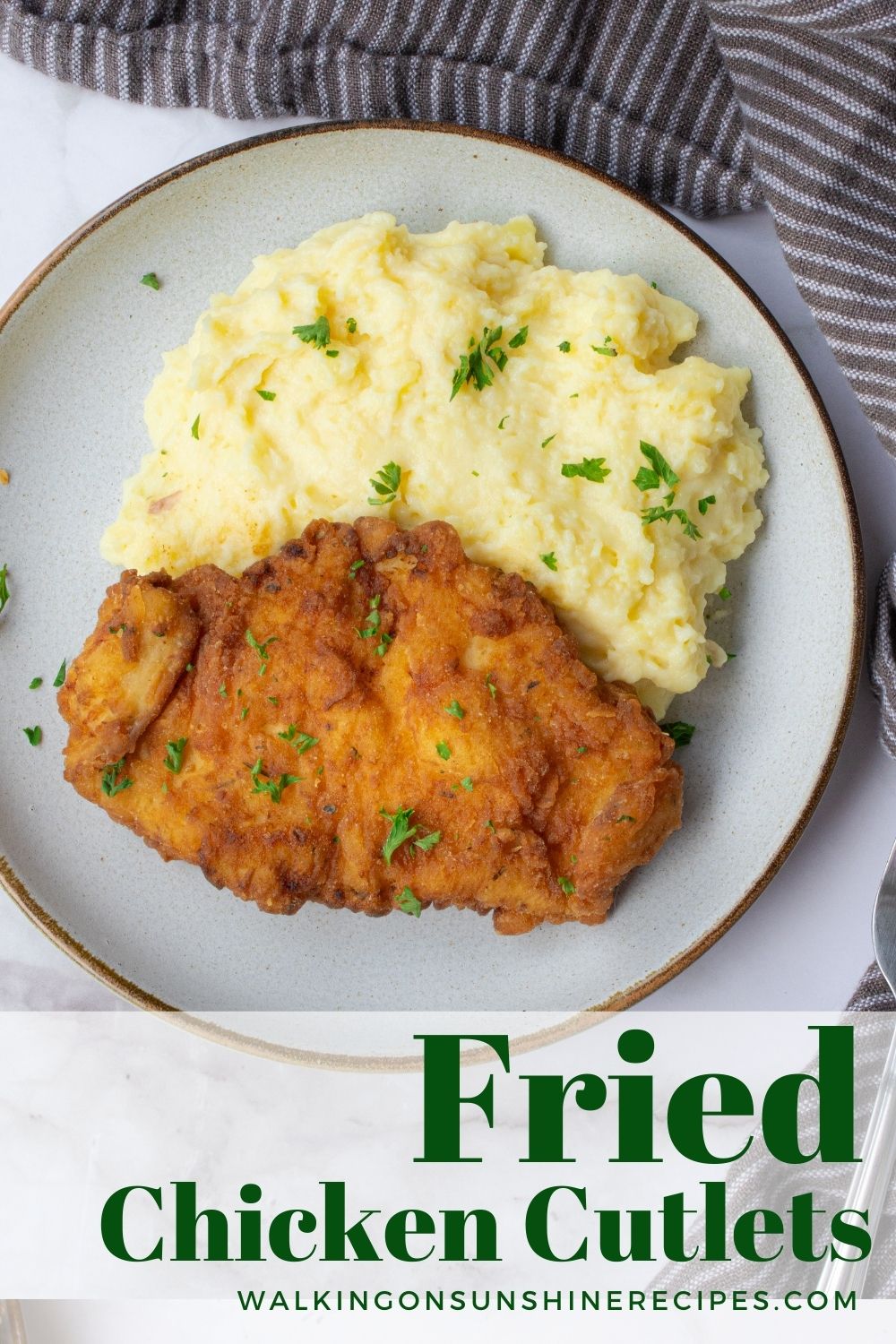 Fried chicken cutlets on plate with mashed potatoes. 