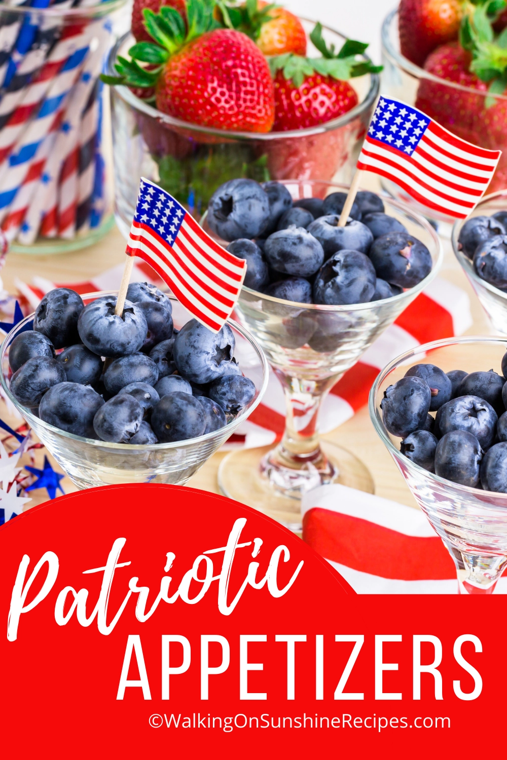 blueberries in cups with mini American flags. 