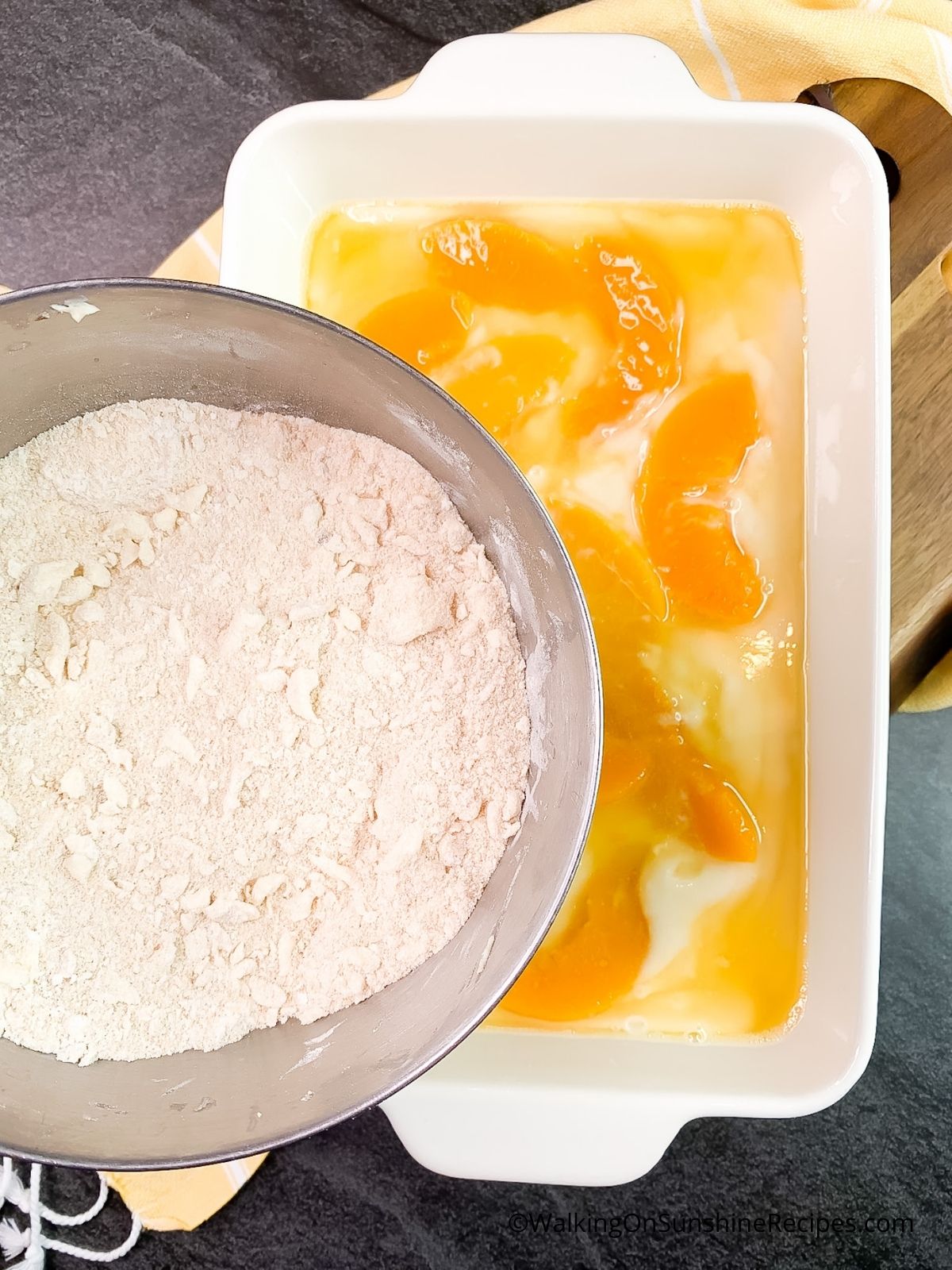 Add brown sugar crumble to top of peaches and batter.