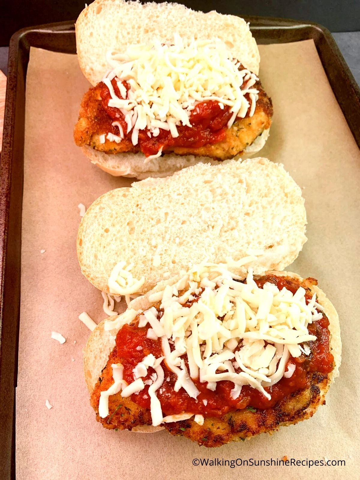 Cheese and Marinara Sauce on top of chicken cutlets.