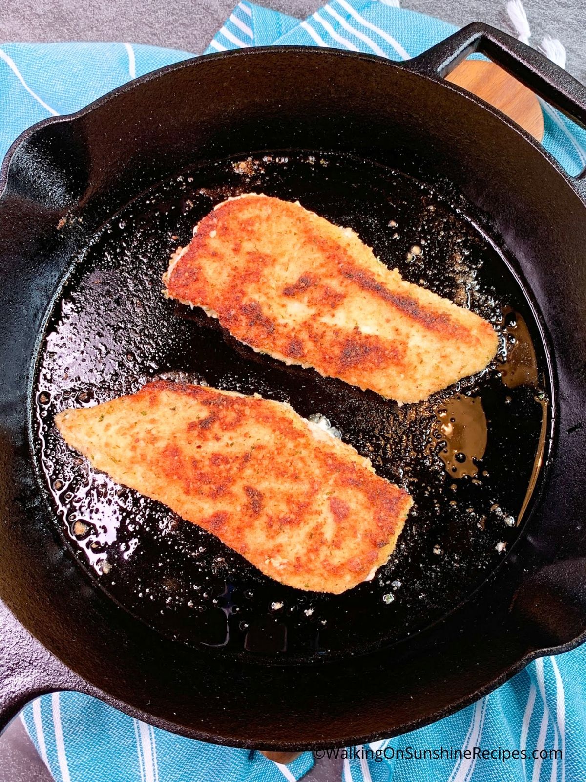 Chicken in cast iron skillet.