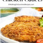 Italian Fried Chicken Cutlets with side salad on white plate