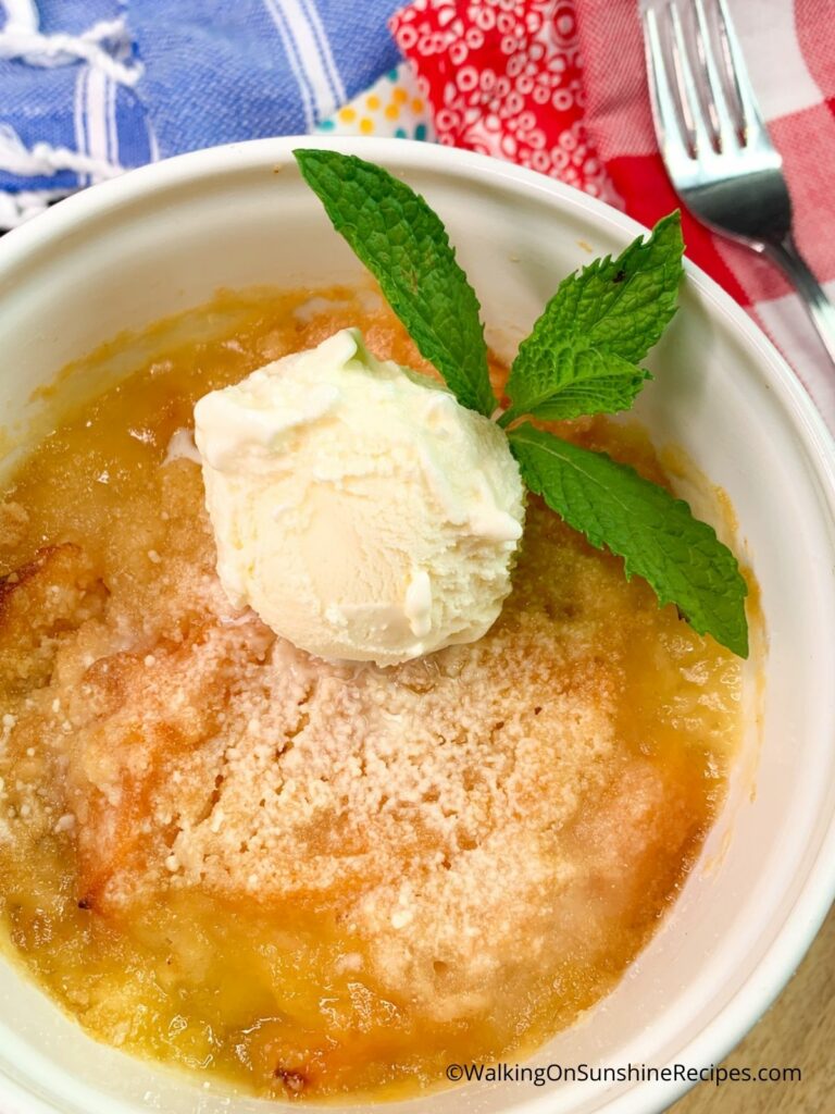 Air fryer dump cake with ice cream and fresh mint.