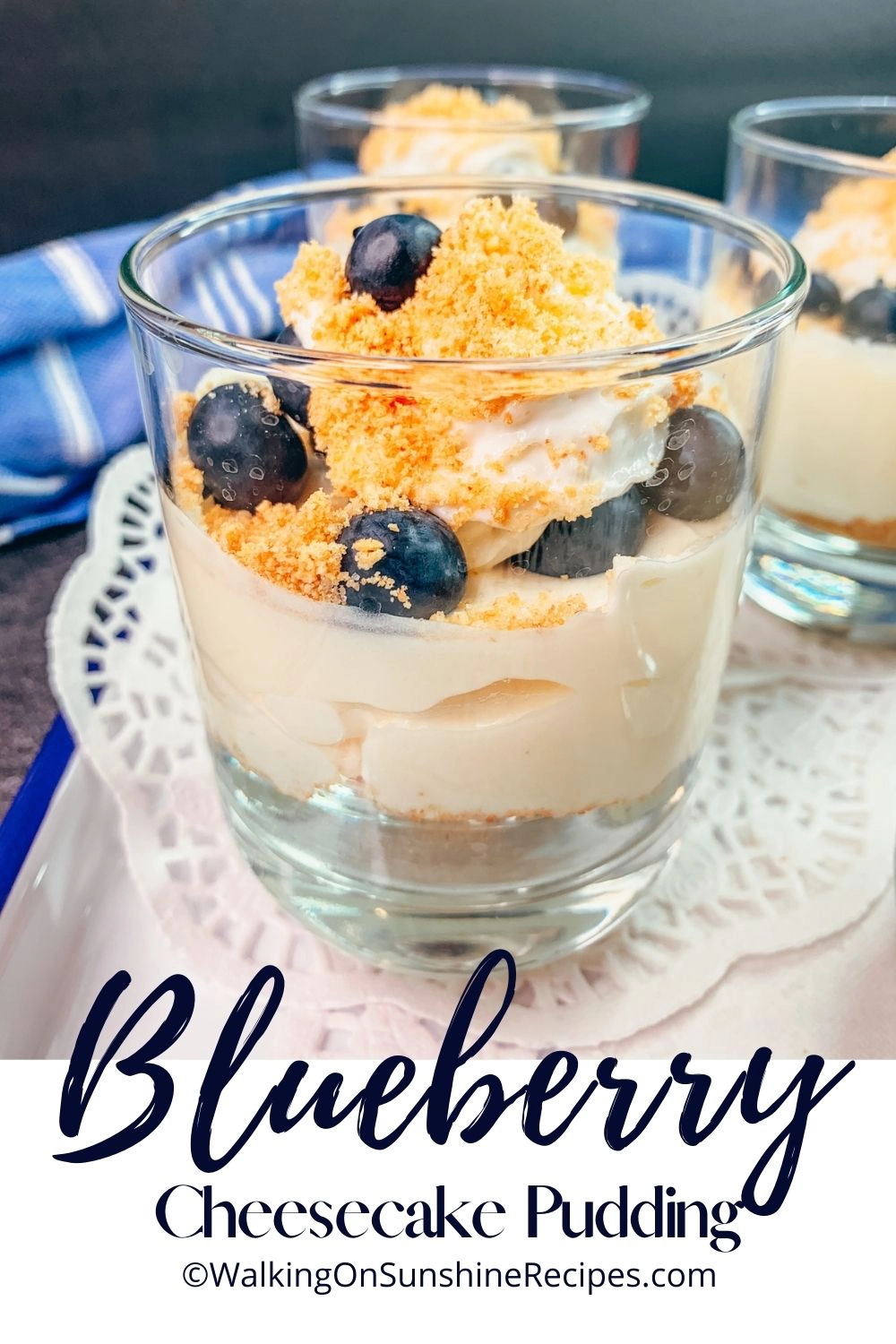 cheesecake pudding in cup with blueberries on top. 
